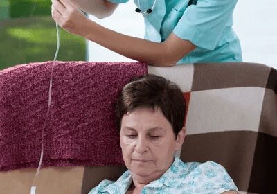 Nurse Keeping Drip-bag for Old Women
